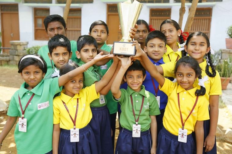 Sri Triveni students lifting their kabaddi winners’ trophy